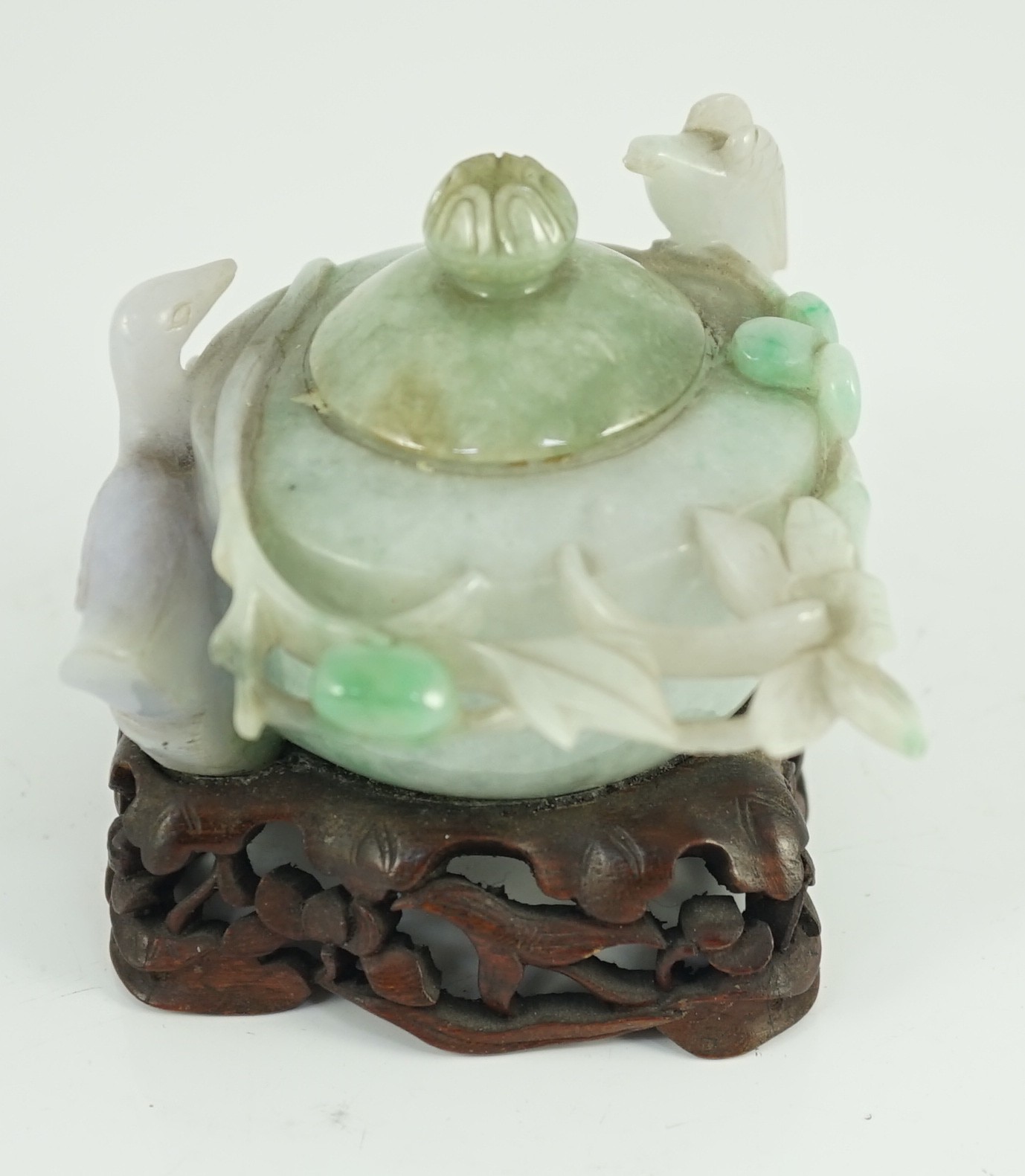 A Chinese lavender and green jadeite water pot and stand, late 19th century, 9.3cm at widest point, wood stand